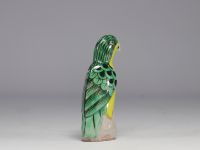 China - Green and yellow glazed ceramic parrot, perched on a rock, Qing period.