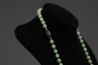 China - green jade pearl necklace with solid silver clasp.