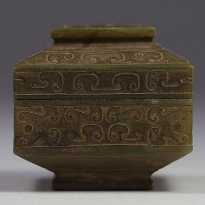 China - covered box in carved jade with archaic decoration.