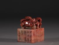 China - Carved stone seal surmounted by two lions, calligraphy, Qing period.