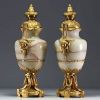 Imposing pair of Louis XVI chased gilt bronze and onyx cassolettes.