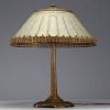 TIFFANY STUDIOS ‘New York’ 1900 - Table lamp with bronze foot and frosted glass shade, signed and numbered under the base.