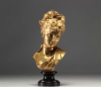 Bust of a young girl in bronze with gilded patina, published by the 