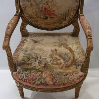 Important ensemble de mobilier de salon en bois sculpté et doré, tapisserie fine d'Aubusson comprenant un canapé et une suite de quatre fauteuils bergères, XIXème.