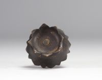 Sculpture of a bronze Buddha resting on a lotus flower from Qing period (清朝)