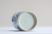 China - A white and blue porcelain brush pot decorated with dignitaries.