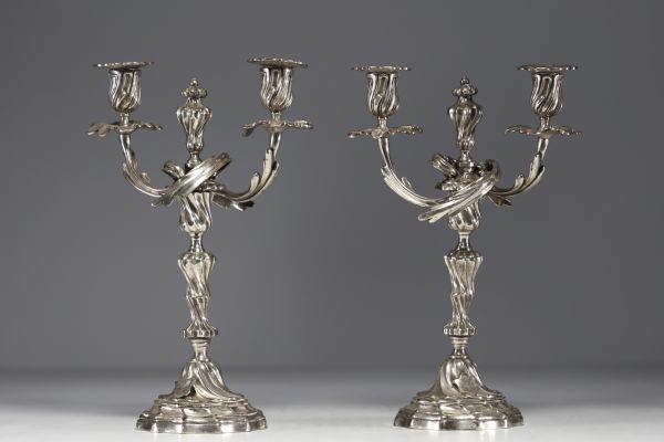 A pair of Louis XV silver-plated bronze candlesticks.