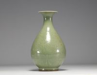 China - Monochrome porcelain vase with floral decoration in relief, 19th century.