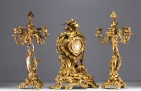 Louis XV style gilt bronze mantelpiece and candelabra, 19th century.