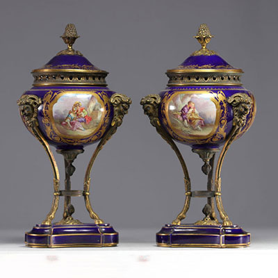 Pair of Sèvres porcelain cassolettes decorated with gallant scenes, mounted on bronze.