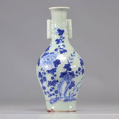 Chinese porcelain vase on celadon background