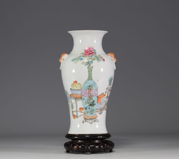China - Famille rose porcelain vase decorated with traditional furniture and a poem.