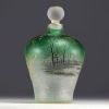 DAUM Nancy - Iridescent glass perfume bottle with enamelled and gold lacustre decoration, signed under the piece.