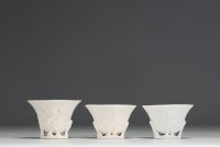 China - Set of three white porcelain libatory bowls.