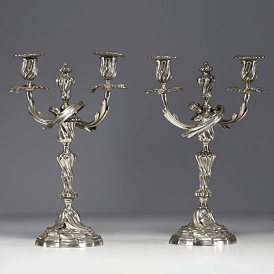 A pair of Louis XV silver-plated bronze candlesticks.