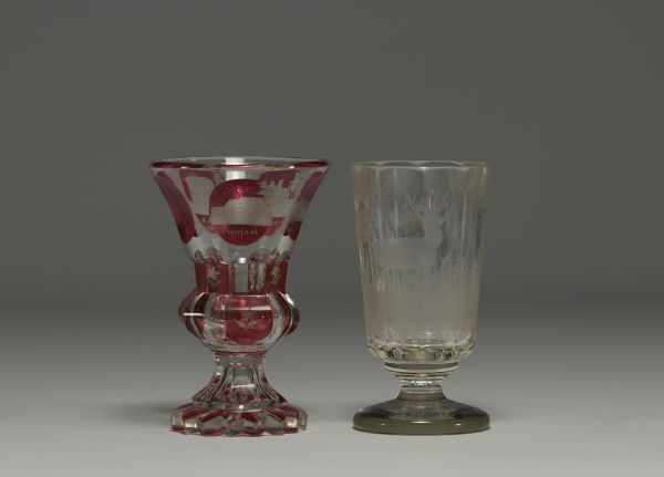 Bohemia - Pair of engraved glasses, one with a deer design and one in multi-layered glass with a city design.