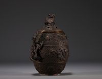 China - Bronze perfume burner decorated with dragons, lid surmounted by a Fô dog.