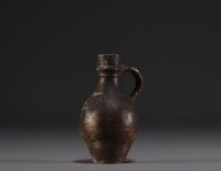 Raeren - Stoneware miniature jug with face decoration, 16th century.