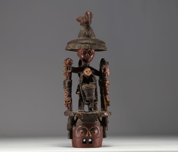 Nigeria - Large, polychromatic Yoruba crest mask with a group of figures.