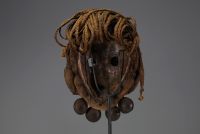 Africa - Dan mask in carved wood, braided ropes and bells, early 20th century