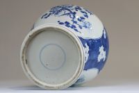 China - White and blue porcelain jug with cartouche decoration of prunus flowers, double-circle mark.