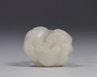 China - White jade carved with Shi Shi decoration, Qing period.