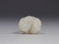 China - White jade carved with Shi Shi decoration, Qing period.