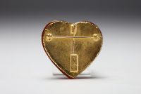 Yves SAINT LAURENT - Heart brooch in imitation amber and gilded metal.