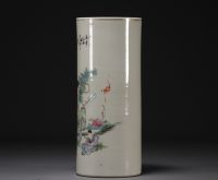 China - Famille rose porcelain brush-holder decorated with figures.