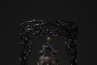 China - Bronze bell surmounted by a dragon, supported by a carved wooden base, circa 1900.