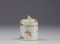 China - Small covered pot enclosing a cup in famille rose porcelain decorated with butterflies.