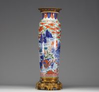 China - A polychrome porcelain vase with cloudy landscape and figures on a bronze frame, Transition period, 17th century.