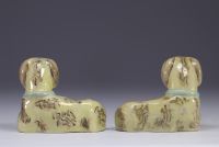 China - pair of glazed porcelain dogs with green collars.