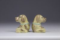 China - pair of glazed porcelain dogs with green collars.