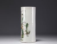 China - A polychrome porcelain brush-holder decorated with characters and a poem, circa 1900.