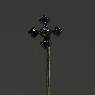 Gold tie pin, one rose-cut diamond and four sapphires.