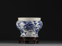 China - A blue-white porcelain vase decorated with lions, Kangxi mark.