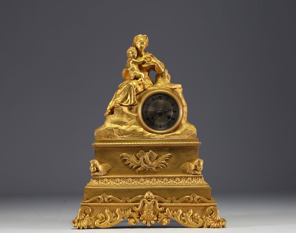 ‘Reading’ Gilt bronze clock decorated with a woman and child, 19th century.