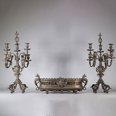 Imposing bronze centerpiece and candelabras decorated with mascarons (devil's heads) from the 19th century