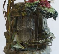 A rare Art Nouveau lamp decorated with a heron trimmed with pearls and water lilies in polychrome bronze.