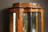 Louis XV style curved display cabinet in veneered wood and bronze, late 19th century, early 20th century.