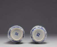 China - Pair of blue-white porcelain vases with figures, Kangxi mark, 19th century.