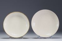 China - Set of two Ding porcelain plates with white glaze, dragon and flowers in relief.