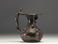 Set of a polished pewter Art Nouveau jug and vase, circa 1900.