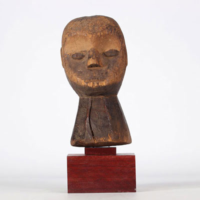 Carved wooden Lega statue on base