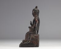 Bronze statue of a traditional figure with dark patinas and traces of gilding from Ming period China (明朝)