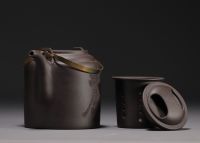 China - Yixing violet clay teapot in its box, 20th century.