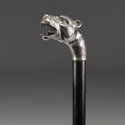 Art Deco silver cane with lioness head decoration and glass eyes.