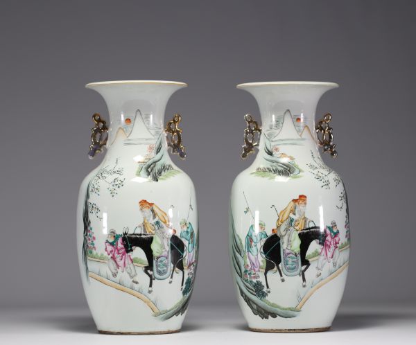 China - Pair of polychrome porcelain vases decorated with sages and poems, early 20th century.