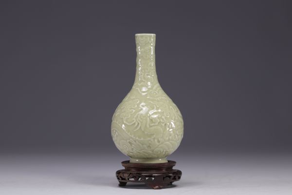 China - Monochrome bottle vase decorated with dragons in relief, Qing period.